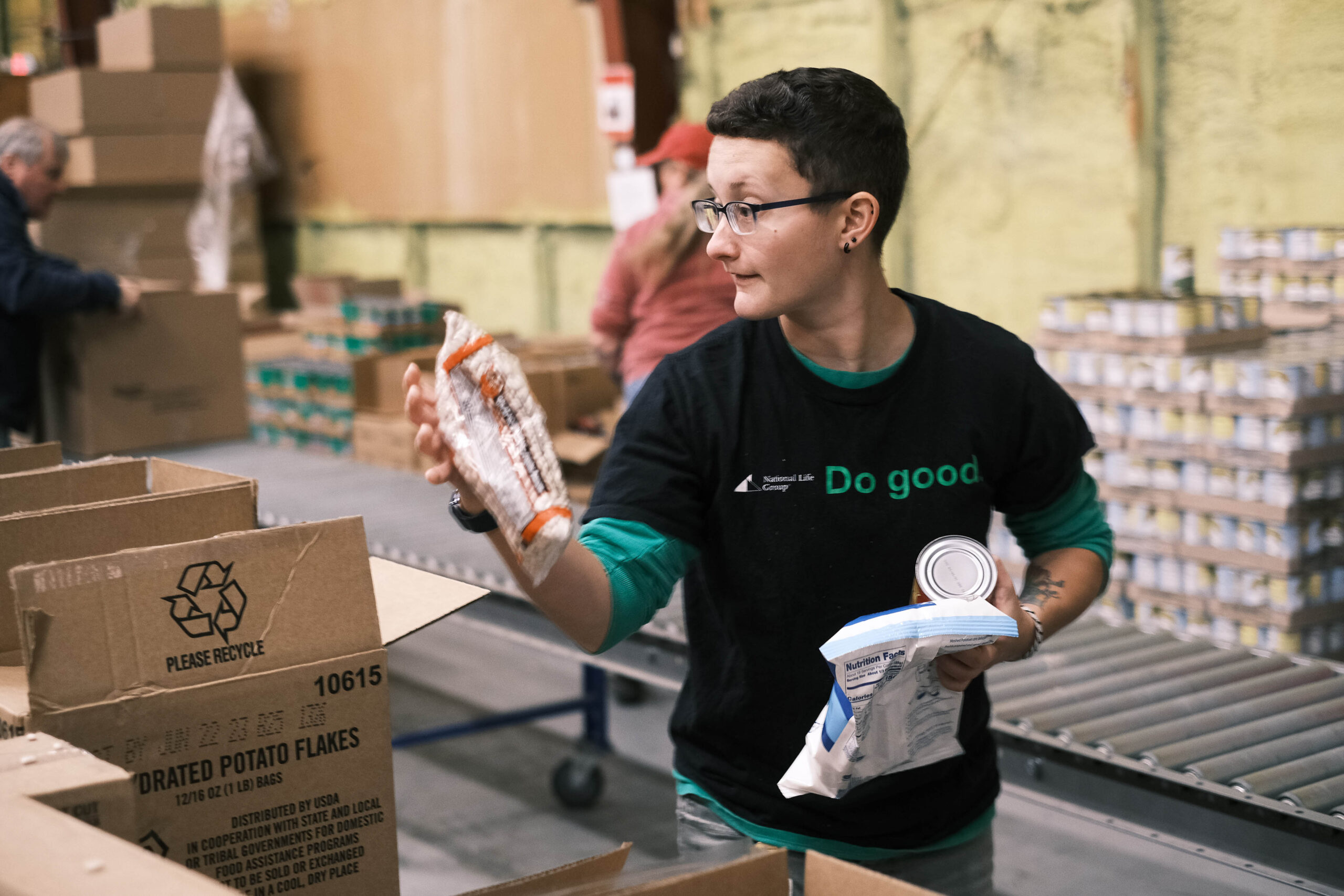 Photo of a National Life volunteer working in our Barre distribution center. Boost your employee engagement by offering volunteer opportunities.