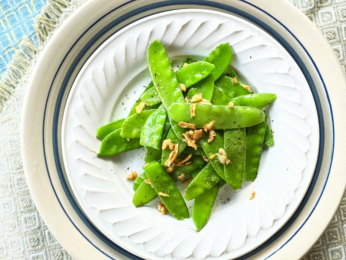 Snow Peas and garlic on a plate