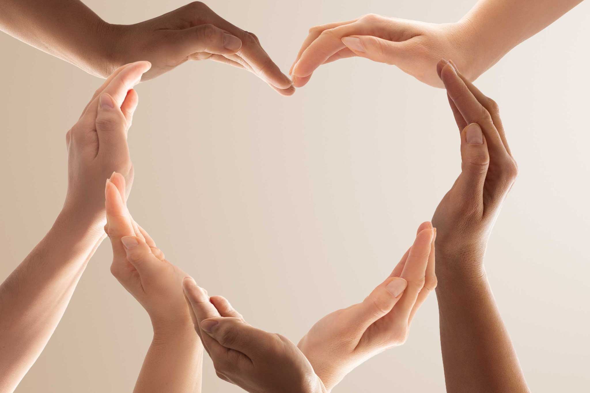 Photo of hands forming a heart shape