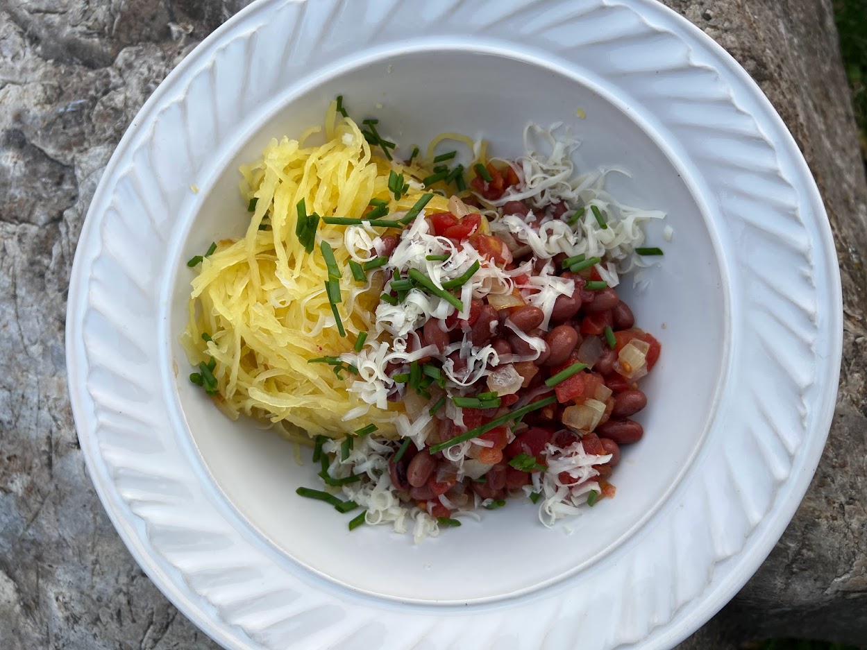 Bowl with cooked spaghetti squash and chili