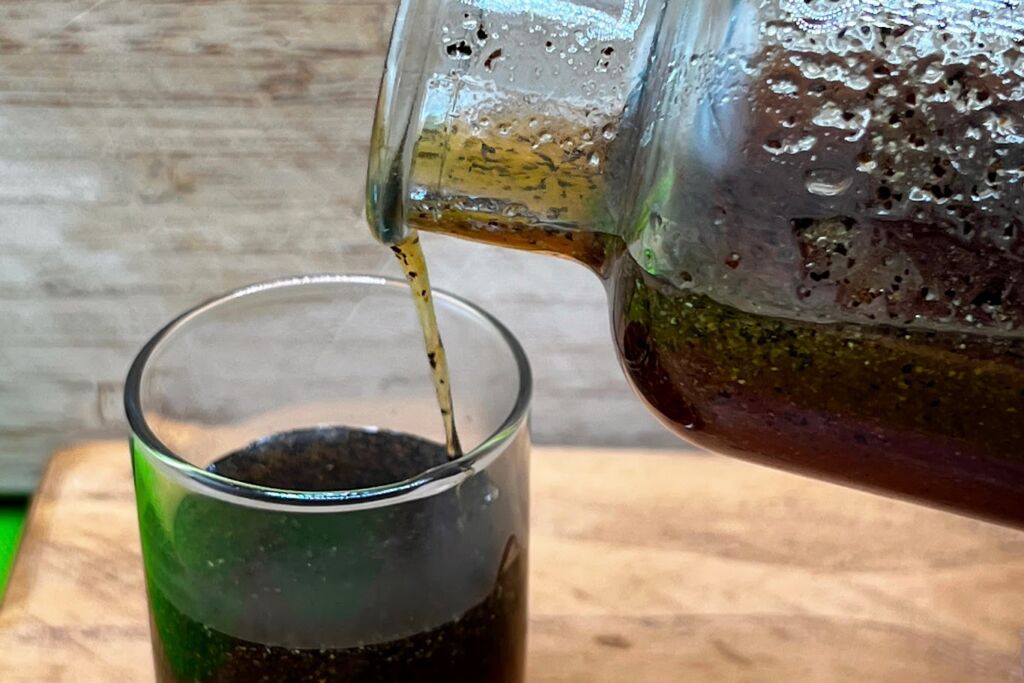 Photo of pouring Savory Maple Glaze into measuring glass.